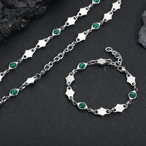 Polished stainless steel necklace and bracelet set with green malachite beads on stone