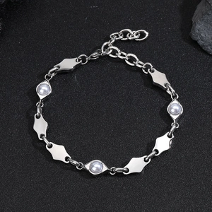 Minimalist stainless steel diamond-shaped bracelet with pearl accents on black stone