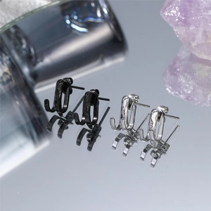 Minimalist double-layered U-shaped stud earrings set in polished black and silver metal