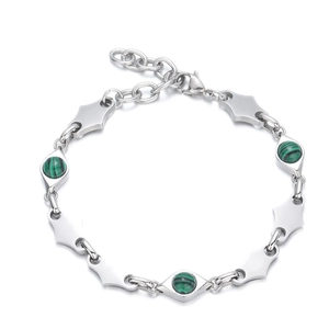 Detail of silver stainless steel bracelet featuring round green stones and diamond-cut links