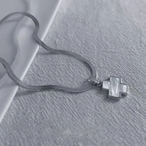 Silver clover cross necklace with white shell inlay and sleek snake chain for women