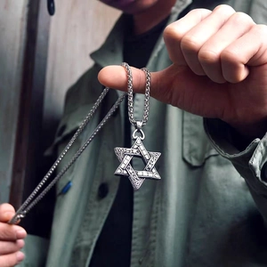 Vintage stainless steel hexagram pendant necklace with intricate carved floral patterns