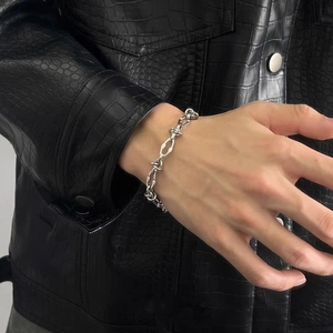Polished silver thorn chain bracelet for men with industrial street style design