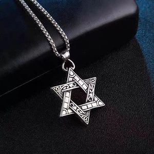 Retro stainless steel Star of David pendant with intricate floral engraving on black leather