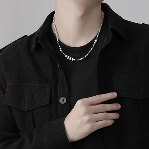 Men's Mobius silver necklace with mixed bead stitching on a minimalist black shirt