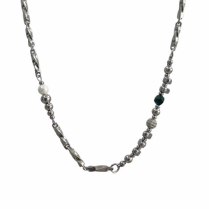 Titanium steel Mobius necklace with silver beads, pearl and green gem on white background