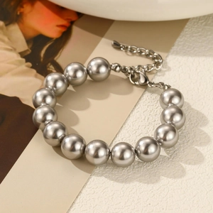 Close-up of minimalist silver pearl necklace with adjustable metal chain and lobster clasp