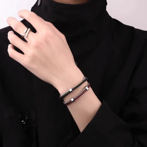 Double-layered braided leather bracelets with minimalist steel sliders for couples