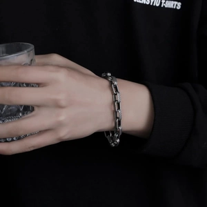 Silver twill engraved titanium steel link chain bracelet worn on male wrist