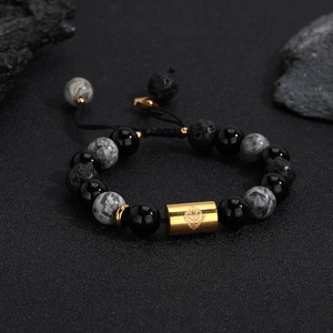 Men's geometric volcanic stone bead bracelet with engraved golden totem cylinder charm