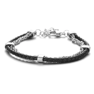 Close-up of double-layer black braided leather cord and silver metal chain bracelet