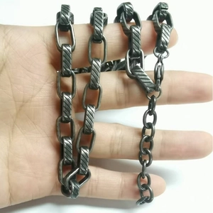 Detailed view of dark grey twill titanium steel chain with vintage industrial textured links