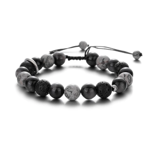 Detail showing lava rock and map stone beaded bracelet with adjustable woven cord