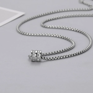 Minimalist titanium steel necklace featuring a cylinder pendant set with sparkling zircon
