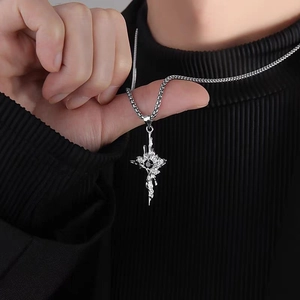 Men's titanium steel thorn cross necklace with black gemstone on black sweater