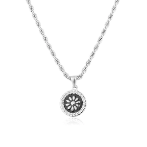 Macro detail of silver daisy flower circular pendant with elegant rope chain design
