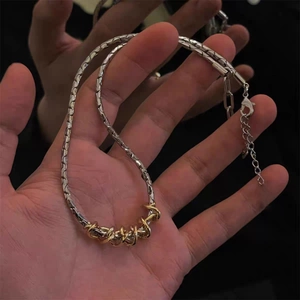 Two-tone twisted chain necklace in gold and silver steel with lobster clasp for women