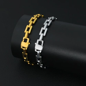 Detailed macro view of gold and silver cuban link bracelets with secure folding clasps