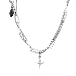 Detail showing double-layered titanium steel chain with star and black gem pendants