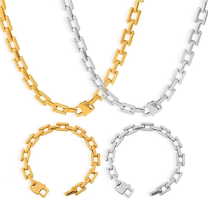 Close-up of gold and silver cuban link chains in stainless steel for men and women