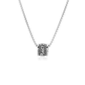 Close-up of the silver stainless steel cylinder pendant with detailed relief carvings