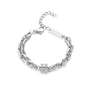 Detail of silver titanium steel bracelet with three pave-set zircon rings and lobster clasp