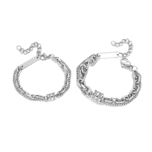 Detail of double-layer titanium steel bracelets with cylinder diamond pendants and lobster clasp