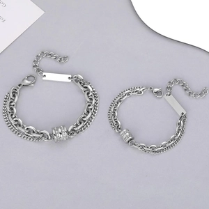Double-layered titanium steel couple bracelet with sparkling crystal paved cylinder charm