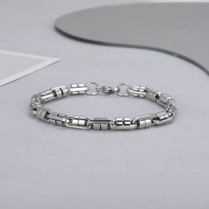 Detailed macro view of the silver stainless steel chain link with secure lobster clasp