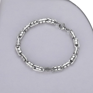 Detail of silver stainless steel thick link chain bracelet with lobster clasp closure