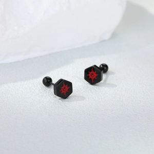 Detail of black hexagonal stainless steel screw studs with red sun swirl pattern