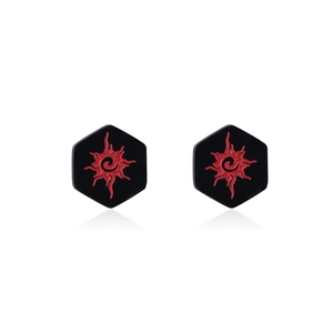 Macro detail of hexagonal stainless steel screw back stud earrings with sun motif