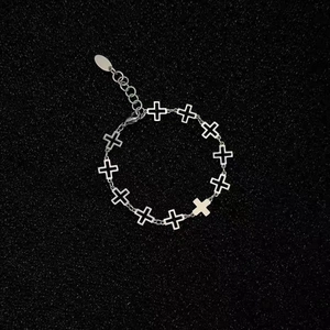 Detail of silver hollow cross link bracelet with lobster clasp and adjustable extension chain