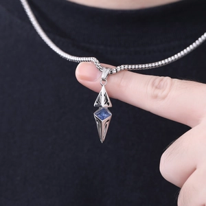 Star-shaped geometric necklace with blue zircon pendant and engraved steel chain