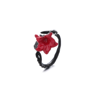 Gothic vintage ring featuring a vibrant red enamel flower on a black thorny branch band
