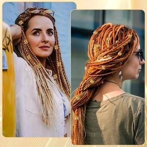 Detail showing golden braid rings on ombre golden brown and orange handmade dreadlocks