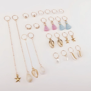 24pcs bohemian ocean style jewelry set with gold shells and tassels on white background