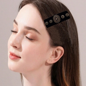 Vintage French velvet hair clip with rhinestone flower decor on a fashion model