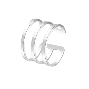 Detailed macro shot of a three-layered silver cuff earring with polished metallic finish