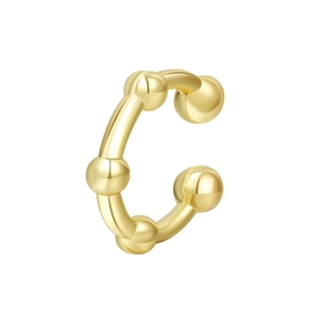 Detail of a polished golden ear cuff featuring a C-shape design with five decorative spheres