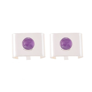 Macro view of silver square hair clasp with round purple amethyst gemstone inlay