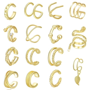 Detail of 15-piece gold ear cuff set showing various spiral and geometric textures