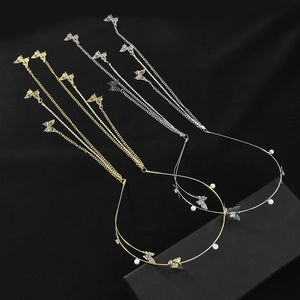 Elegant gold and silver metal headbands featuring pearls and long butterfly tassels