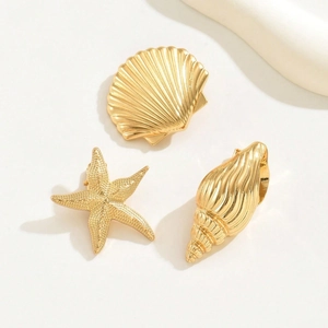 Golden alloy sea shell and starfish hair clip set with a minimalist metallic finish
