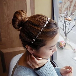 Detail of silver star headband showing intricate alloy stars on a slim metal hair hoop