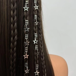 Hair braid rings with hollow star pendants on dark brown braided hair extensions