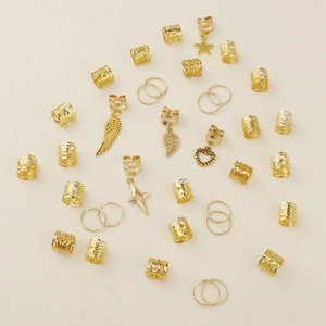 35-piece golden alloy braid rings set with charms like wings stars and leaves