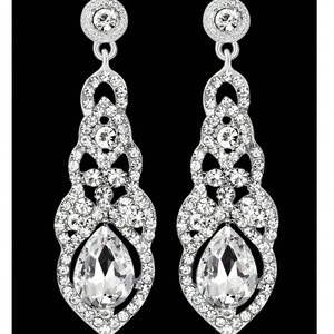 Elegant silver long drop earrings with flower patterns and pear-shaped crystals