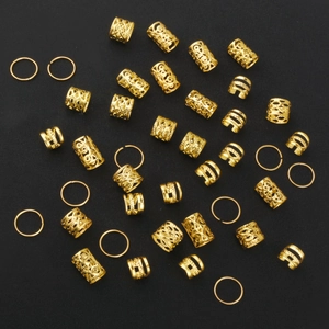 40pcs gold dreadlock beads and rings set for hair braiding accessories on black background