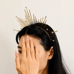 Golden halo crown headband with radiating metal spikes and sparkling rhinestones
